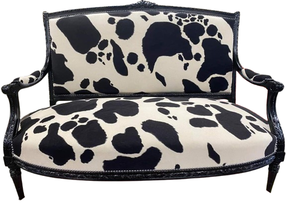 Canapé blanc à motifs noirs (vache)